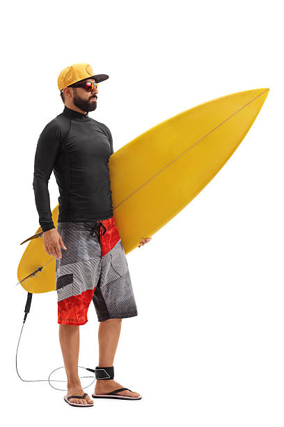istock Male surfer holding a surfboard 618341446