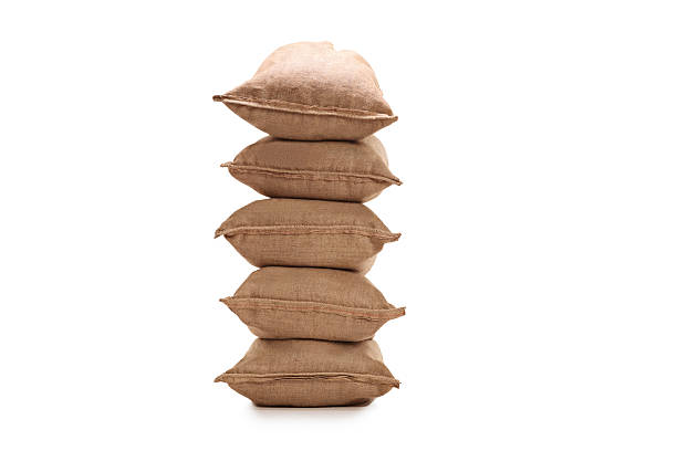 Stack of burlap sacks Stack of burlap sacks isolated on white background sack photos stock pictures, royalty-free photos & images