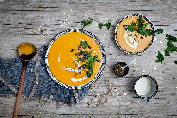 istock Pumpkin cream soup with Christmas decoration 618342266