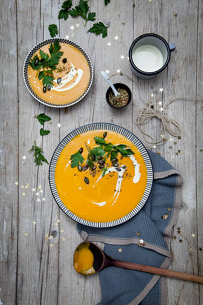 istock Pumpkin cream soup with Christmas decoration 618342406