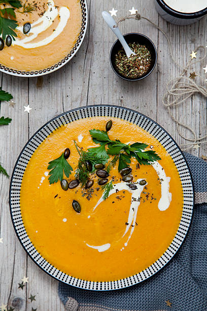 istock Pumpkin cream soup with Christmas decoration 618342526