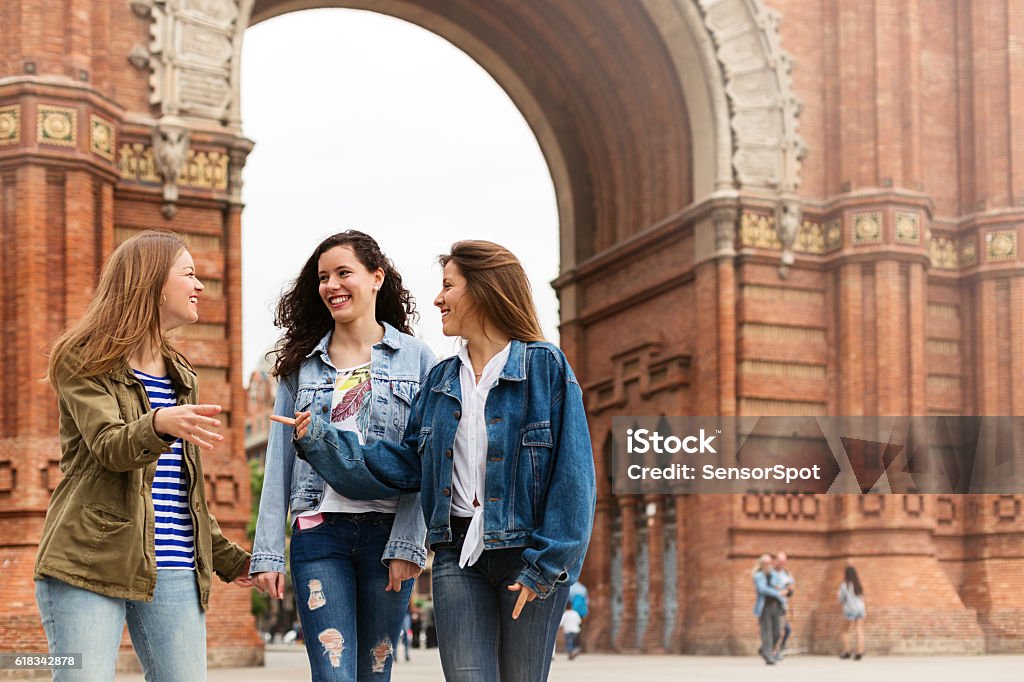 Young tourists walking and having fun in Barcelona Three young tourists or friends walking and having fun in Barcelona, Spain. Natural light. Horizontal photography from a DSLR camera. Sharp focus. Spain Stock Photo