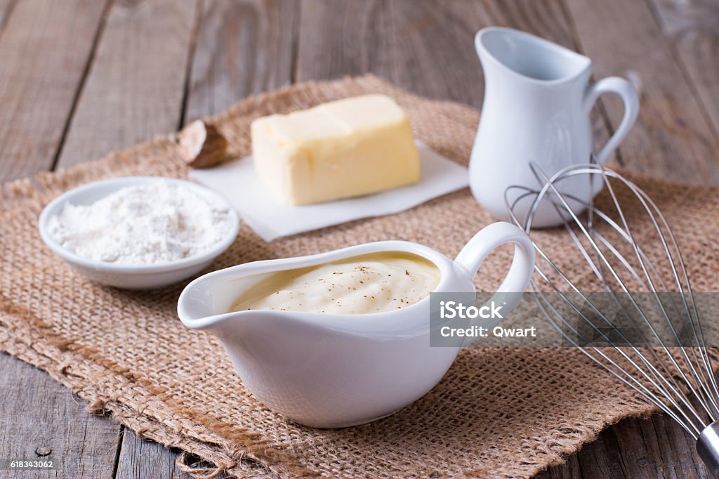 Bechamel sauce on kitchen table Bechamel Sauce Stock Photo