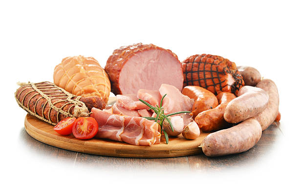 istock Meat products including ham and sausages isolated on white 618344806