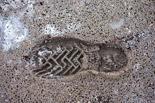 istock Shoe print on the frozen ground 618346218