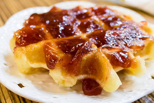 istock Fresh Belgian liege waffle with strawberry jam 618346834