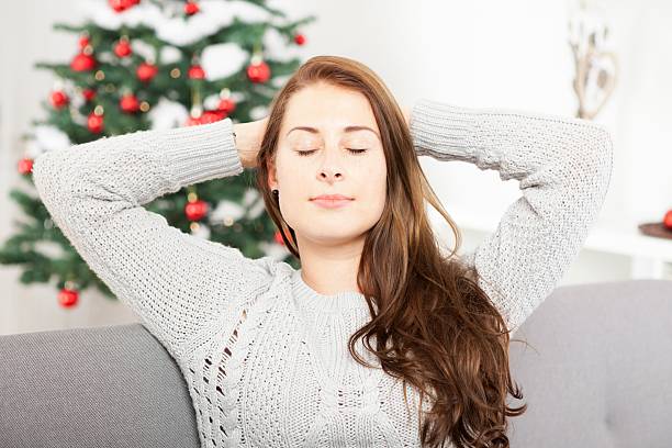 istock young girl is relaxing after christmas stress 618346870
