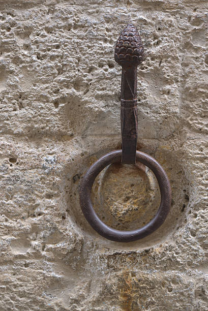 istock Outdoor old horse hitching ring on a historical wall 618351926