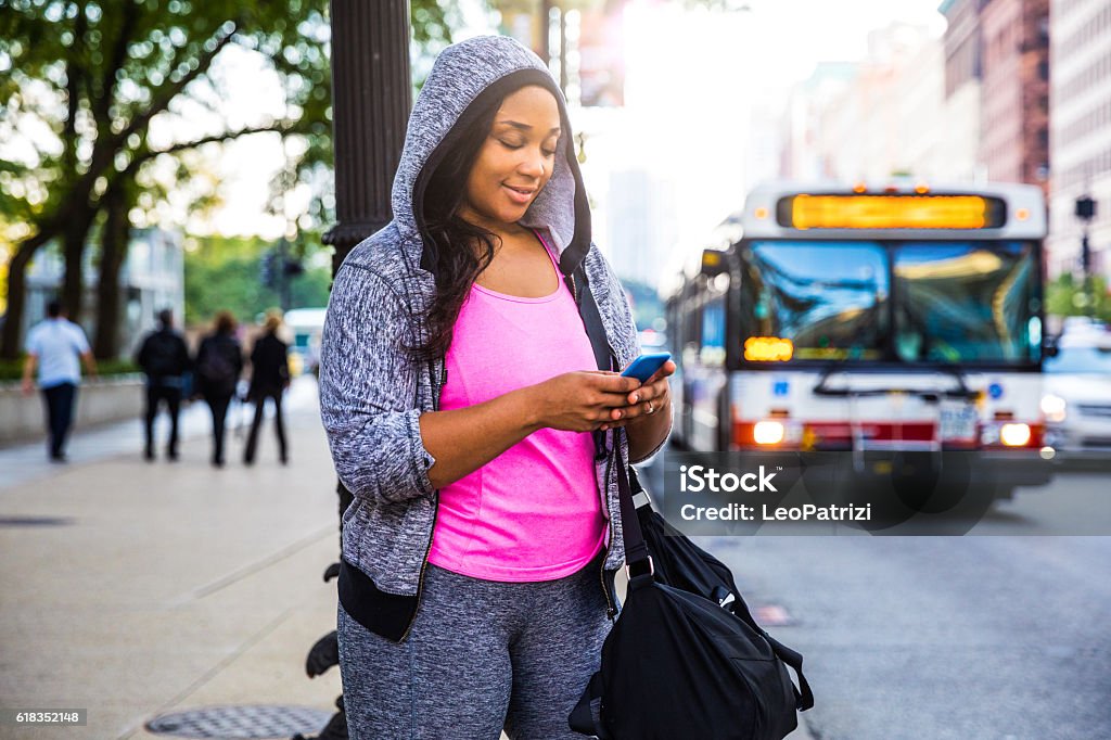 Young woman going to the gym in Chicago - USA Plus size women jogging and exercising at the park and walking outdoor in the city streets in Chicago, United States - USA. Weight loss concept Chicago - Illinois Stock Photo
