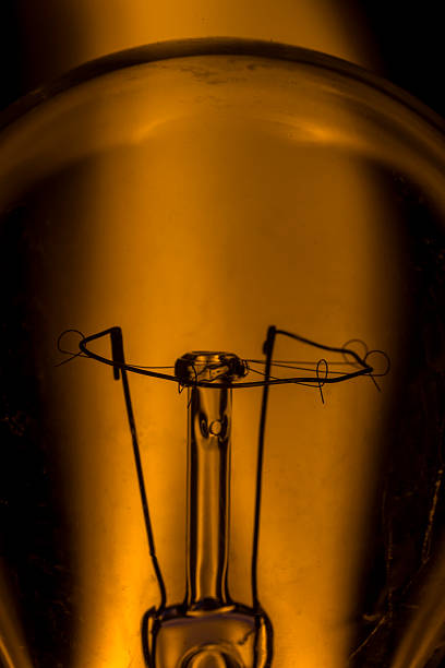 Marco shot of a tungsten light bulb burning like a candle.