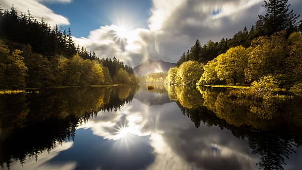 The Glencoe Lochan with a clear reflection in autumn This shot was taken in Scotland glencoe scotland photos stock pictures, royalty-free photos & images