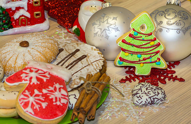 istock Gingerbread cookie in the shape of decorated Christmas tree 618356168