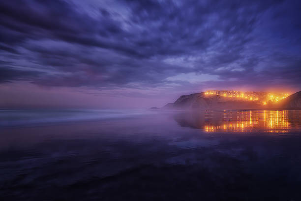 houses reflection on Sopelana beach houses reflection on the Sopelana beach at night sopelana stock pictures, royalty-free photos & images