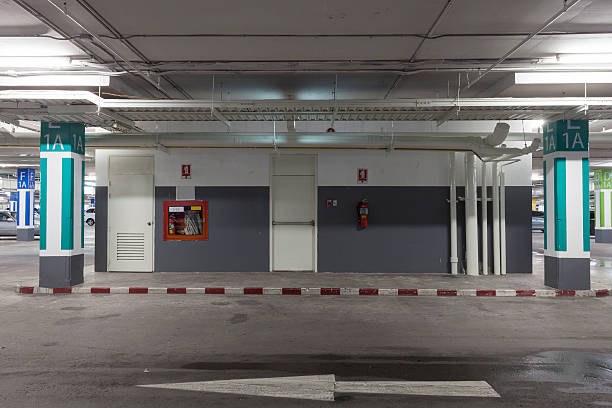 istock Parking garage interior, industrial building, hydrant with water 618357192