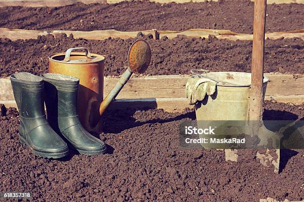 The Beginning Of The Summer Season Boots Shovel Garden Stock Photo - Download Image Now