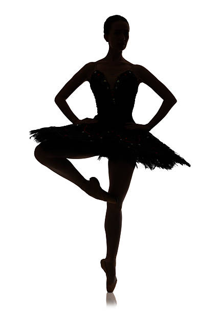 ballerina silhouette macht ballett position pirouette vor weißem hintergrund, isoliert - ballet dress studio shot costume stock-fotos und bilder