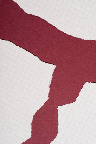 istock Pieces of torn paper over the dark red background 618357586
