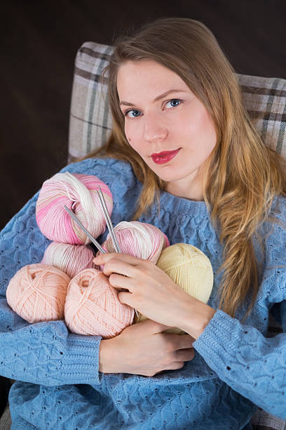istock Knitter girl with yarn 618358772