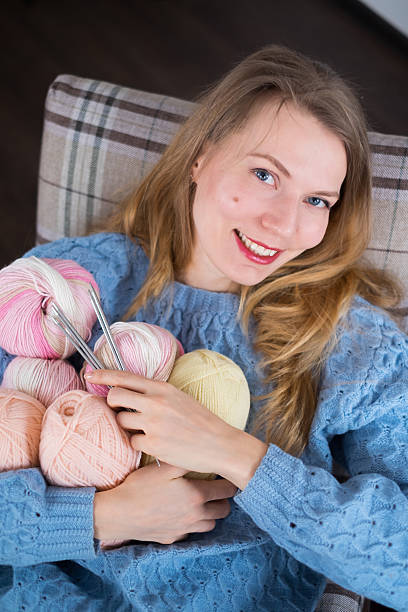 istock Knitter girl with yarn 618358840