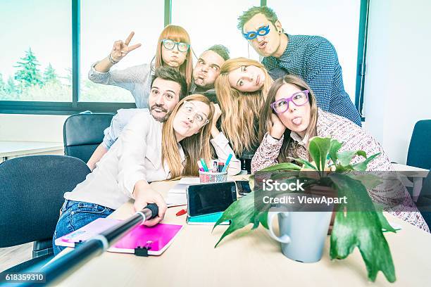 Group Of Happy Students Employee Workers Taking Selfie At Work Stock Photo - Download Image Now