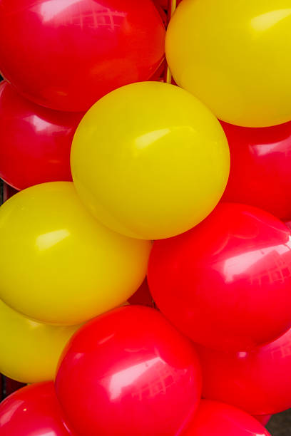 istock red and yellow balloons abstract background 618360090