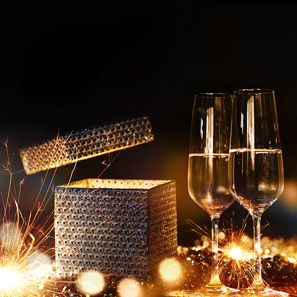 Magical gift with champagne Magical gift with champagne and sparkling Background stars in your eyes stock pictures, royalty-free photos & images