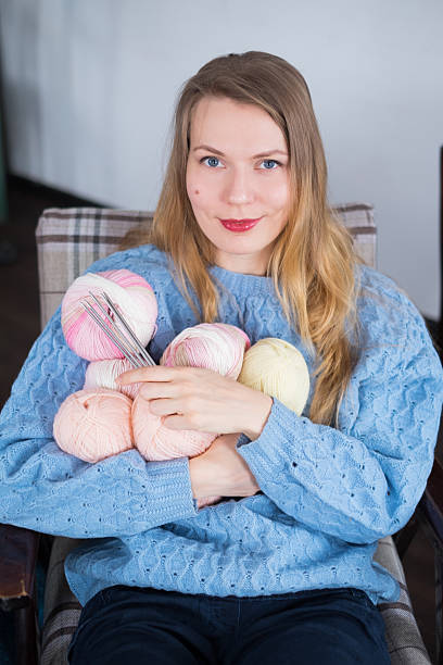 istock Knitter girl with yarn 618361018