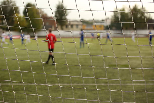 istock goalkeeper in the football match 618361544