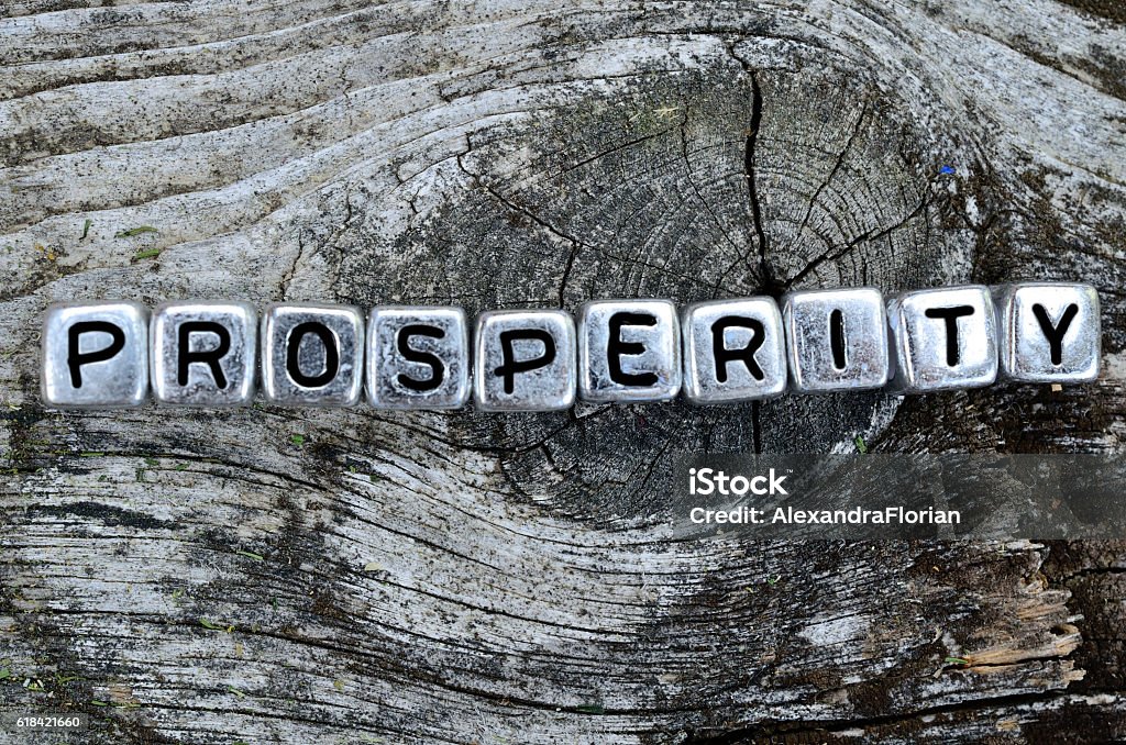 cube word prosperity on table cube word prosperity on wooden table Prosperity Stock Photo