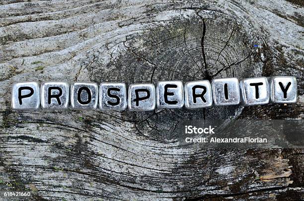 Cube Word Prosperity On Table Stock Photo - Download Image Now - Prosperity, Alphabet, Concepts