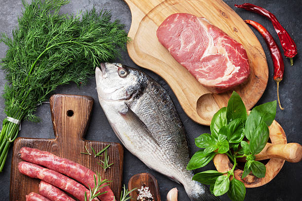 istock Sausages, fish and meat cooking 618422226