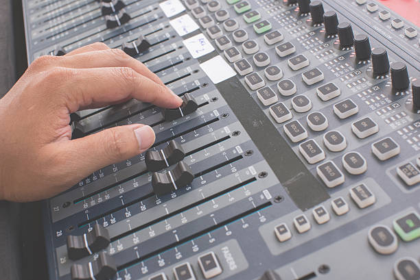 istock music equipment,hand adjust audio mixer 618423164