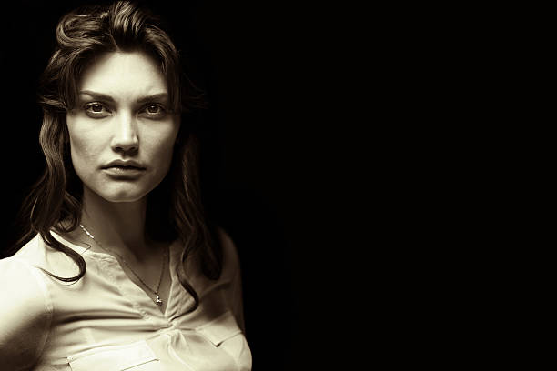 black and white portrait portrait of a girl on a black background. black and white image big fat lips stock pictures, royalty-free photos & images