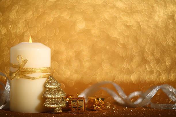 istock Christmas candle on shiny background 618425670