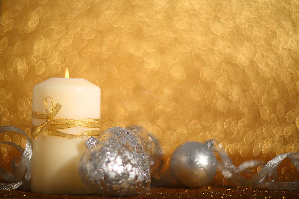 istock Christmas candle on shiny background 618425678