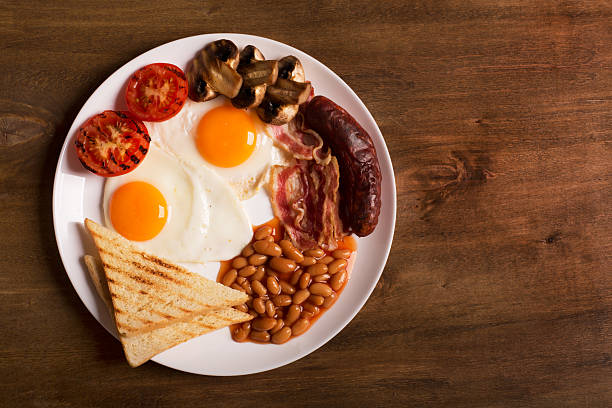 English breakfast on a white wooden table stock photo