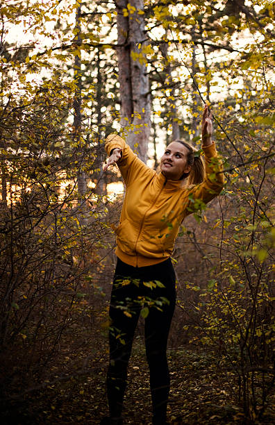 girl with blue eyes is lost in wild forest. - leafes autumn grass nature imagens e fotografias de stock