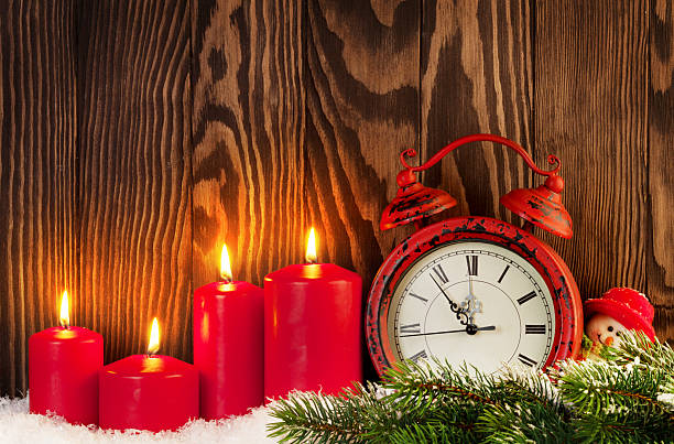 istock Christmas background with candles, alarm clock 618427542