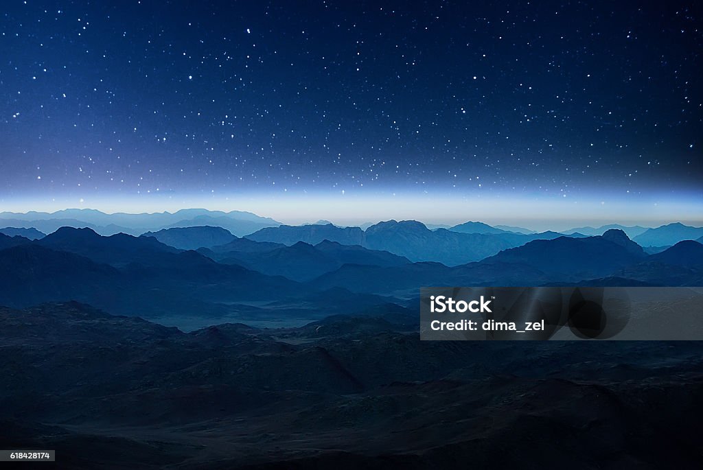 Night mountains before sunrise in the Egypt. Night mountains before sunrise in the Egypt. Sinai Peninsula, view from the mountain of Moses Mountain Stock Photo