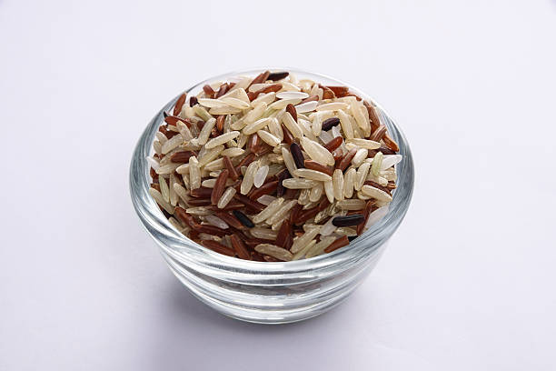 istock brown rice mixed in glass bowl 618428522