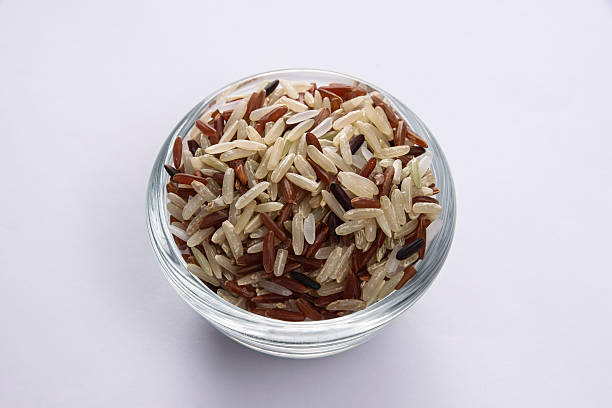 istock brown rice mixed in glass bowl 618428558