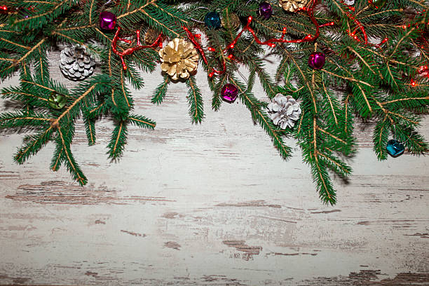 istock Christmas wooden background with fir tree. View with copy space 618429122