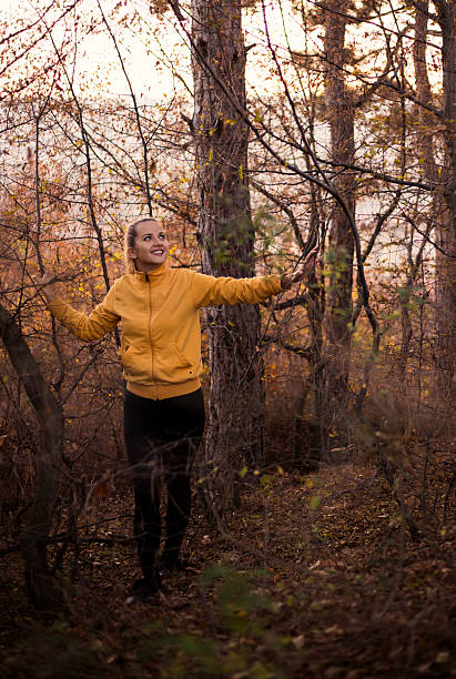 girl with blue eyes is lost in wild forest. - leafes autumn grass nature imagens e fotografias de stock