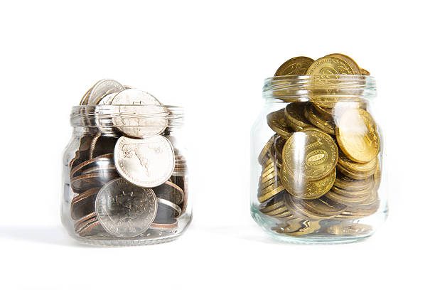 istock Glass bank for tips with money isolated on white. 618430638