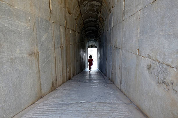 istock Historic Temple corridor. Cute little boy running. 618432222