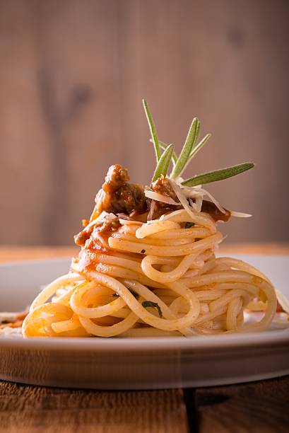 istock White plate with portion of spaghetti with minced meat 618432368