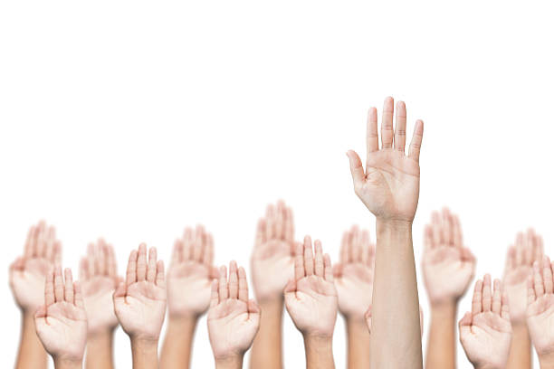 istock business crowd raising hands, many hands raise high up 618433624