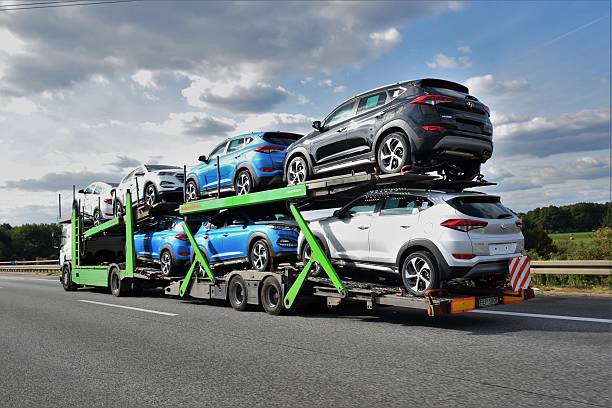 Car transporter driving on the highway Berlin, Germany - September 20th, 2016: Kassbohrer car transporter driving on the highway. This car transporter has 7 Hyundai Tucson (from Czech factory) cars on board. The Kassbohrer car transporters are the ones of the most popular transporters in Europe. car transporter photos stock pictures, royalty-free photos & images