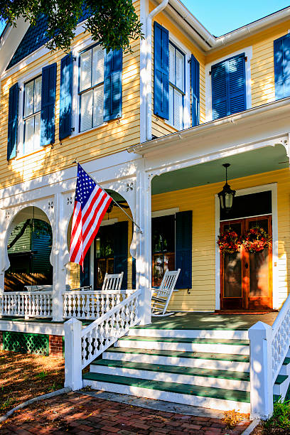 Yellow and white painted home in Fernandina Beach City, Florida Fernandina Beach, FL, USA - September 7, 2016: Yellow and white painted home in Fernandina Beach City, Florida fernandina beach stock pictures, royalty-free photos & images