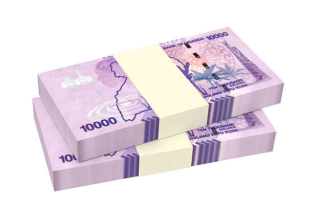 istock Ugandan shillings bills isolated on white background. 618439078